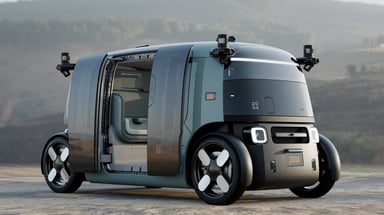 Intérieur du robotaxi Zoox avec sièges vert aloe face-à-face et sans volant, prêt pour la production de masse