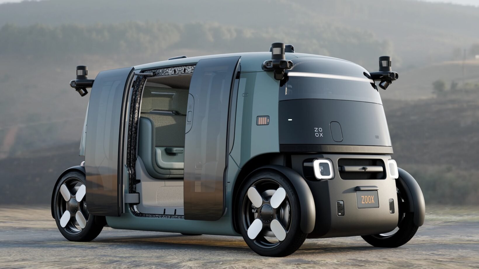 Intérieur du robotaxi Zoox avec sièges vert aloe face-à-face et sans volant, prêt pour la production de masse