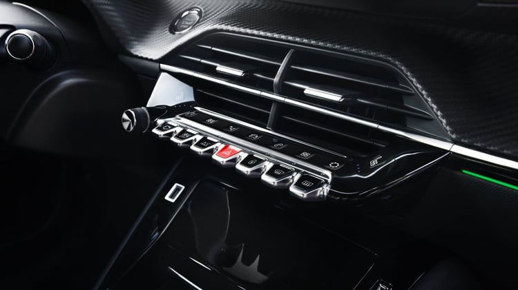 Commandes centrales et boutons bascule de la Peugeot 208 électrique première génération
