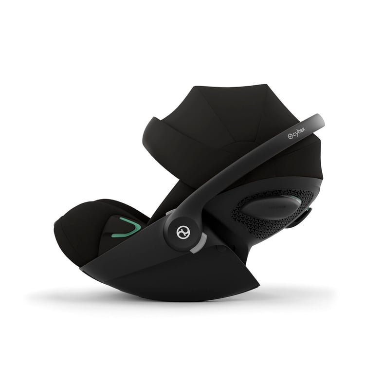 Coque Cybex Cloud G i-Size de profil, dépliée en position allongée à plat hors voiture