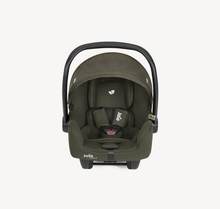 Coque bébé Joie i-Snug 2 i-Size vue de face, harnais et réducteur nouveau-né visibles